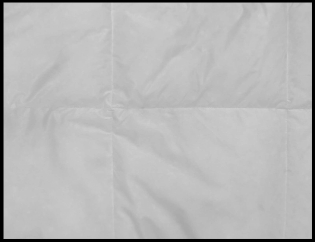 Sewn through down comforter